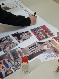 Nahaufnahme einer Fotocollage zu den Projekten rund um das Denkmal der Grauen Busse, die gerade gestaltet wird.